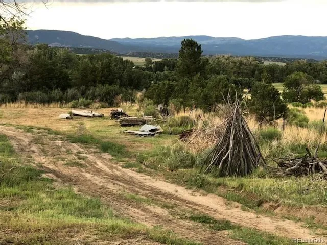 a view of a town with mountains in the background