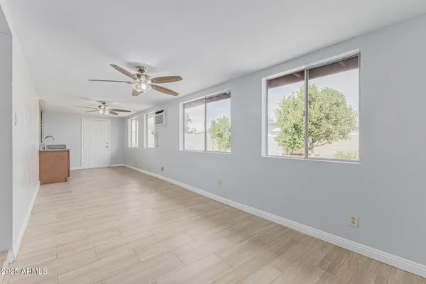a view of an empty room with a window