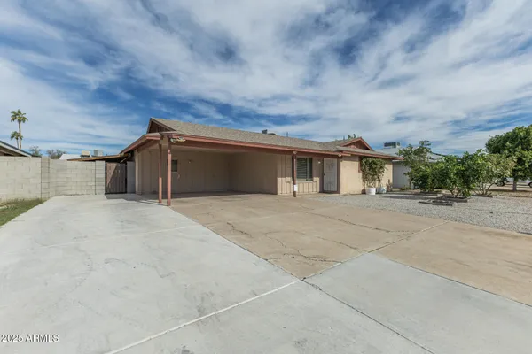 front view of a house with a dry yard