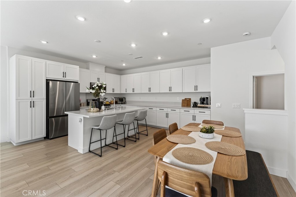 1572 Lima Way, Unit 6 Placentia, CA 92870 - Photo 11 of 36 a kitchen with white cabinets and stainless steel appliances