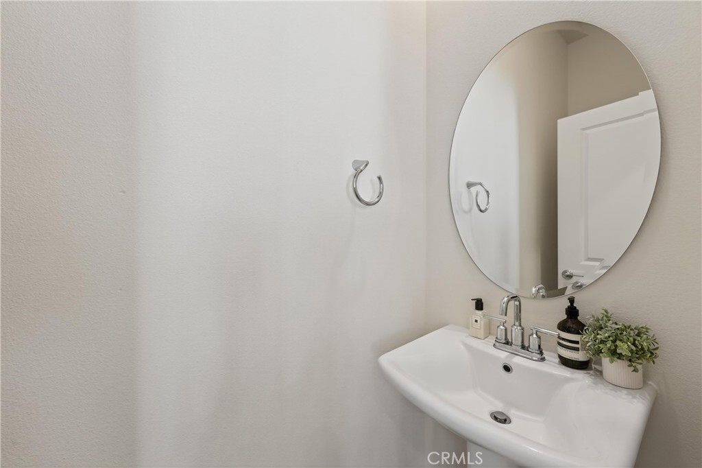 1572 Lima Way, Unit 6 Placentia, CA 92870 - Photo 17 of 35 a bathroom with a sink and mirror