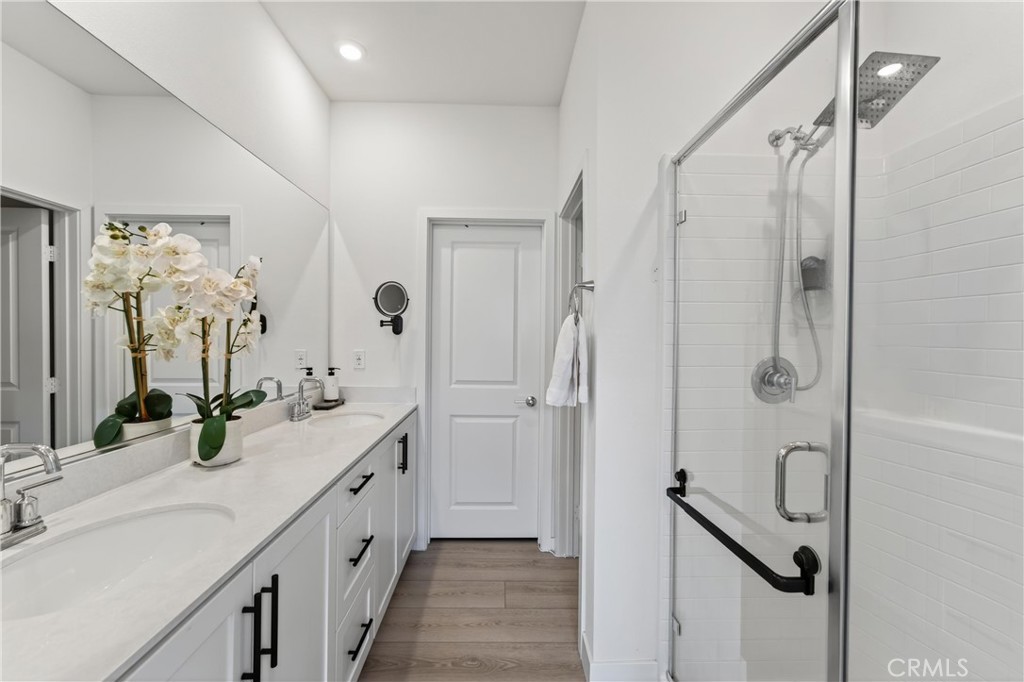 1572 Lima Way, Unit 6 Placentia, CA 92870 - Photo 25 of 36 a spacious bathroom with double vanity and mirrors
