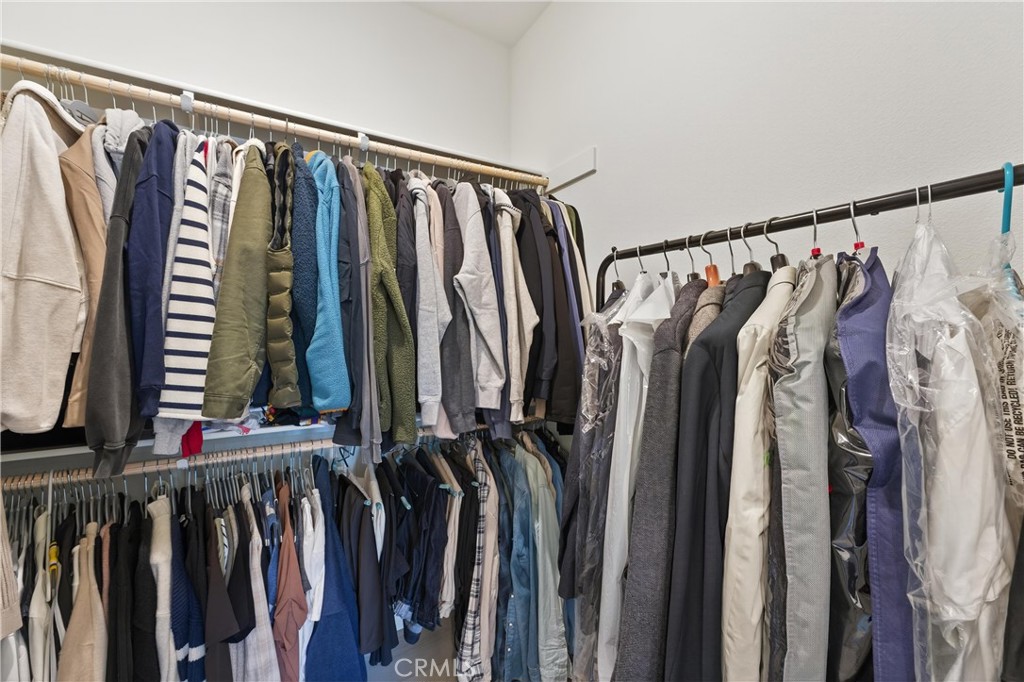 1572 Lima Way, Unit 6 Placentia, CA 92870 - Photo 28 of 35 a view of walk in closet with clothes