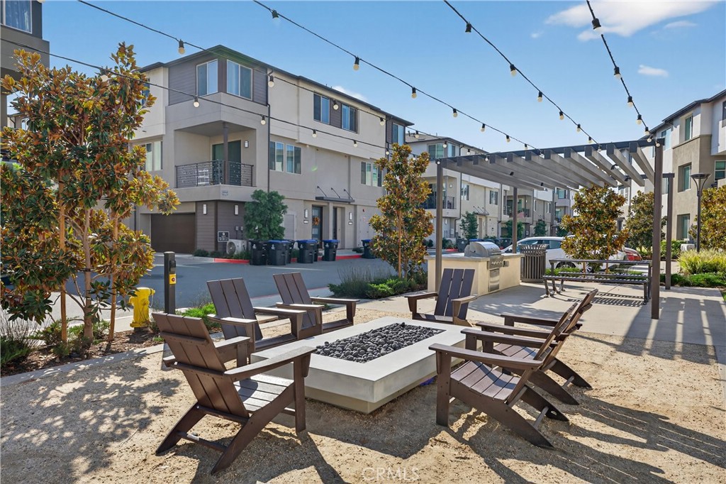 1572 Lima Way, Unit 6 Placentia, CA 92870 - Photo 31 of 35 a view of a patio with couches table and chairs and potted plants
