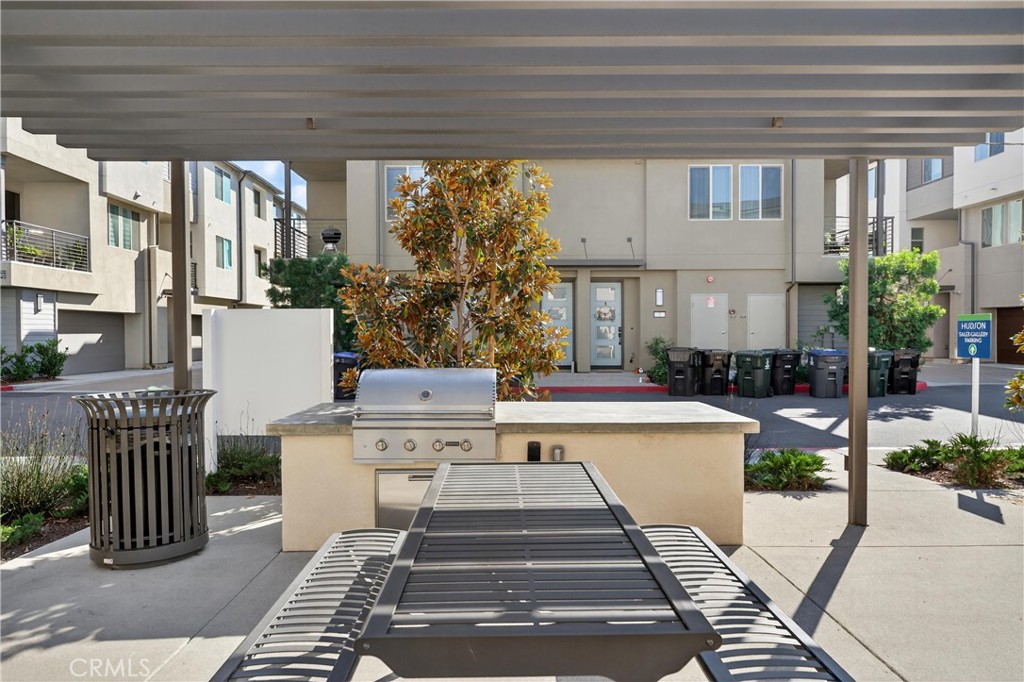 1572 Lima Way, Unit 6 Placentia, CA 92870 - Photo 33 of 36 a view of a patio with couches table and chairs and potted plants