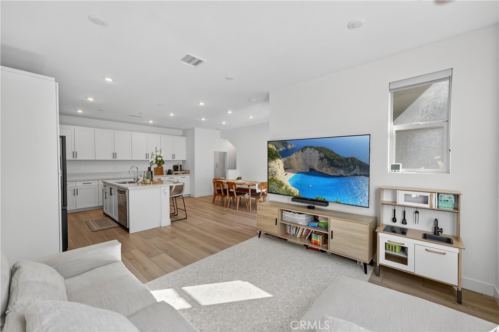 1572 Lima Way, Unit 6 Placentia, CA 92870 - Photo 5 of 36 a living room with furniture and kitchen view