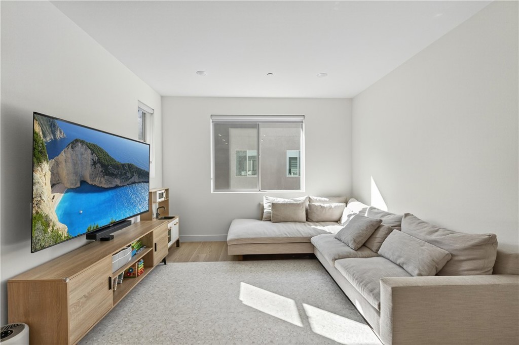 1572 Lima Way, Unit 6 Placentia, CA 92870 - Photo 5 of 35 a living room with furniture and a flat screen tv