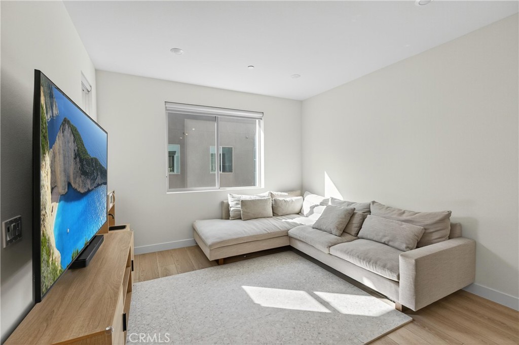 1572 Lima Way, Unit 6 Placentia, CA 92870 - Photo 8 of 36 a living room with furniture and a flat screen tv