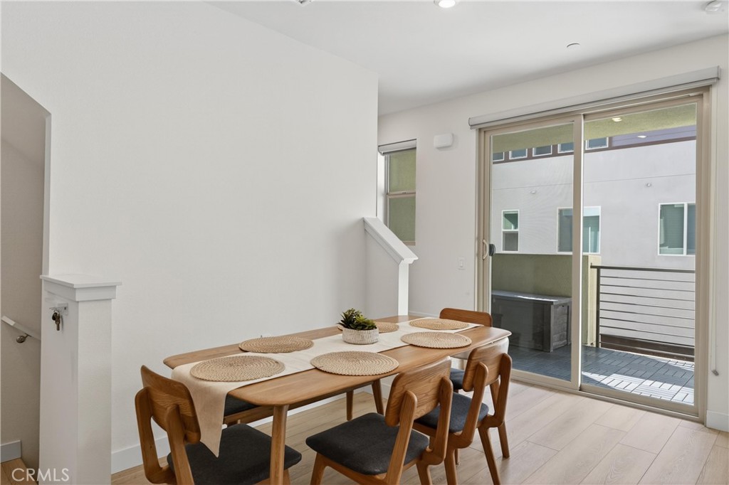 1572 Lima Way, Unit 6 Placentia, CA 92870 - Photo 9 of 36 a view of a dining room with furniture and wooden floor