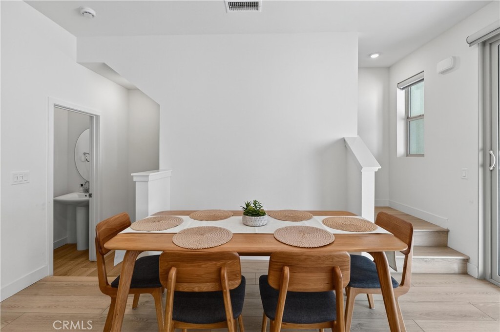 1572 Lima Way, Unit 6 Placentia, CA 92870 - Photo 10 of 36 a dining room with furniture and wooden floor