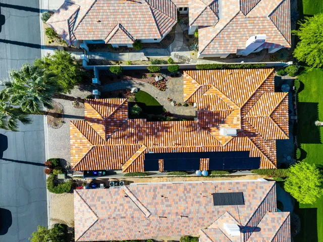 a view of a house with swimming pool and a yard