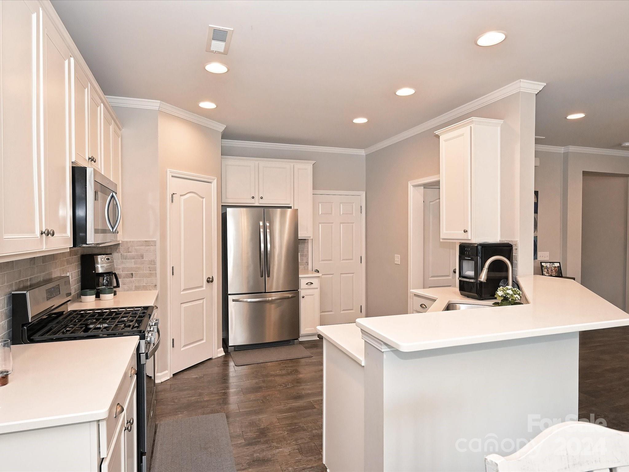 4041 Woodsmill Road Indian Land, SC 29707 - Photo 15 of 36 a kitchen with refrigerator a sink and a refrigerator