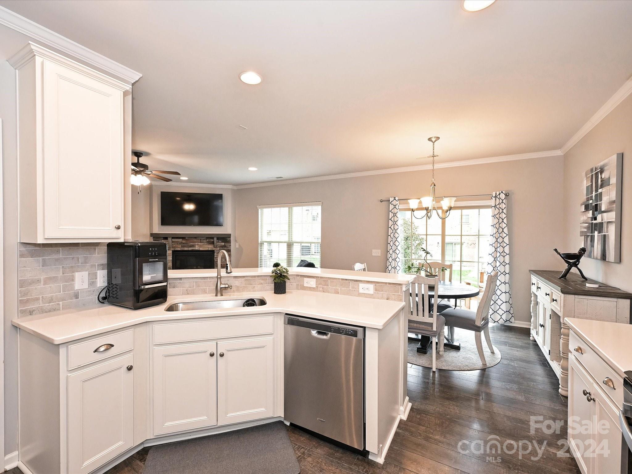 4041 Woodsmill Road Indian Land, SC 29707 - Photo 16 of 36 a kitchen with a sink stove and cabinets