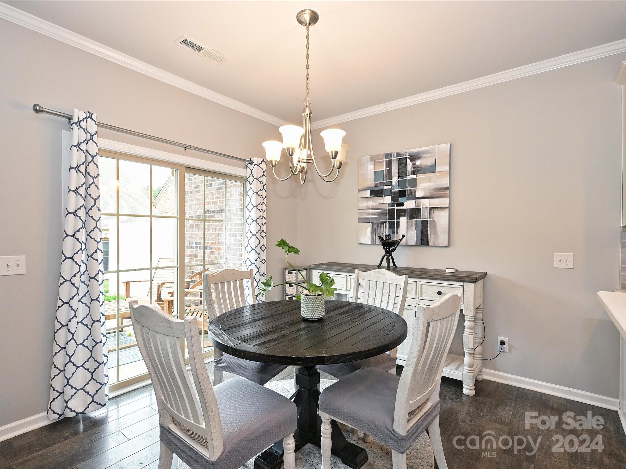 4041 Woodsmill Road Indian Land, SC 29707 - Photo 18 of 36 a dining room with furniture a chandelier and window