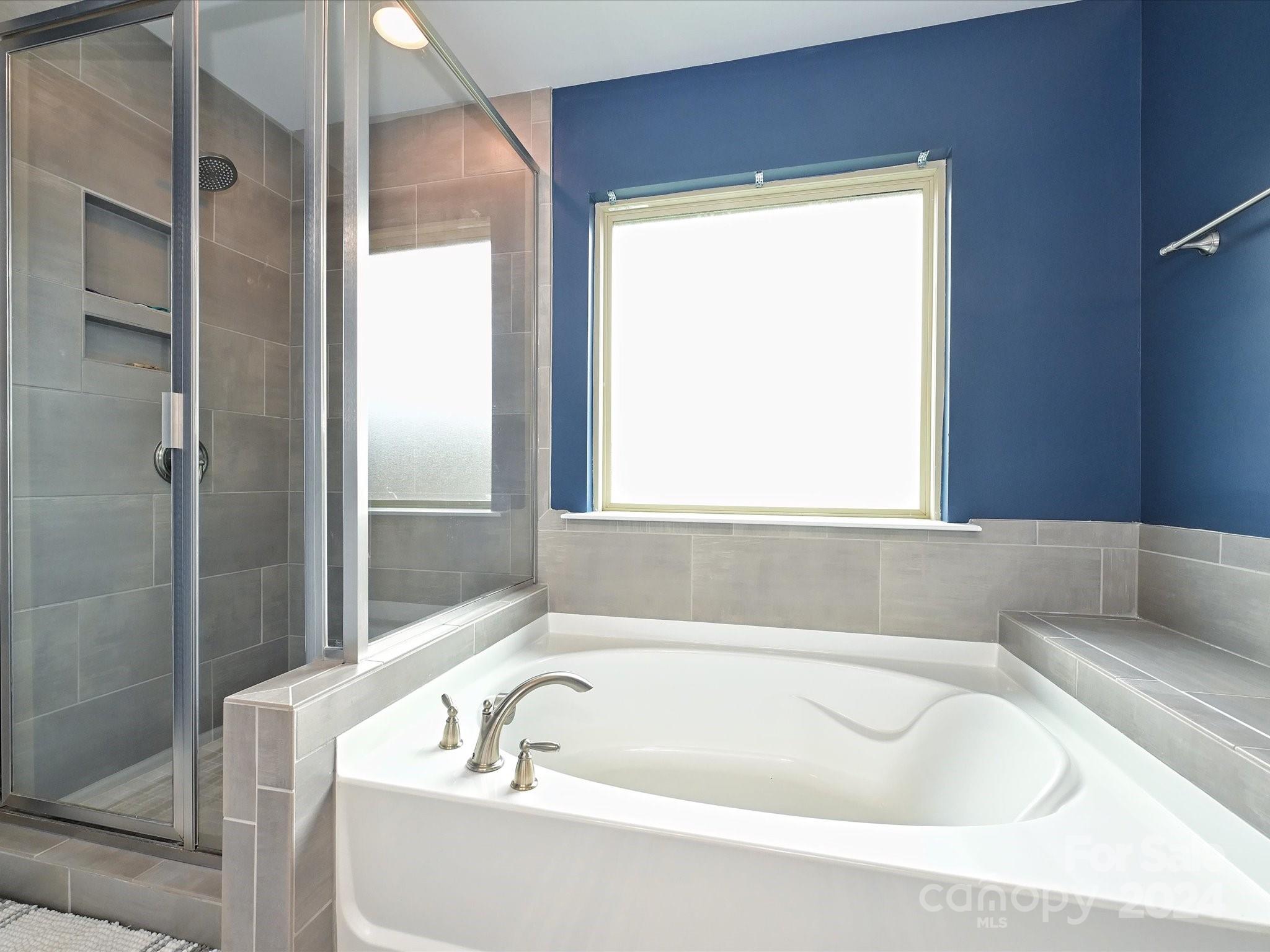 4041 Woodsmill Road Indian Land, SC 29707 - Photo 26 of 36 a bathroom with a bathtub and shower