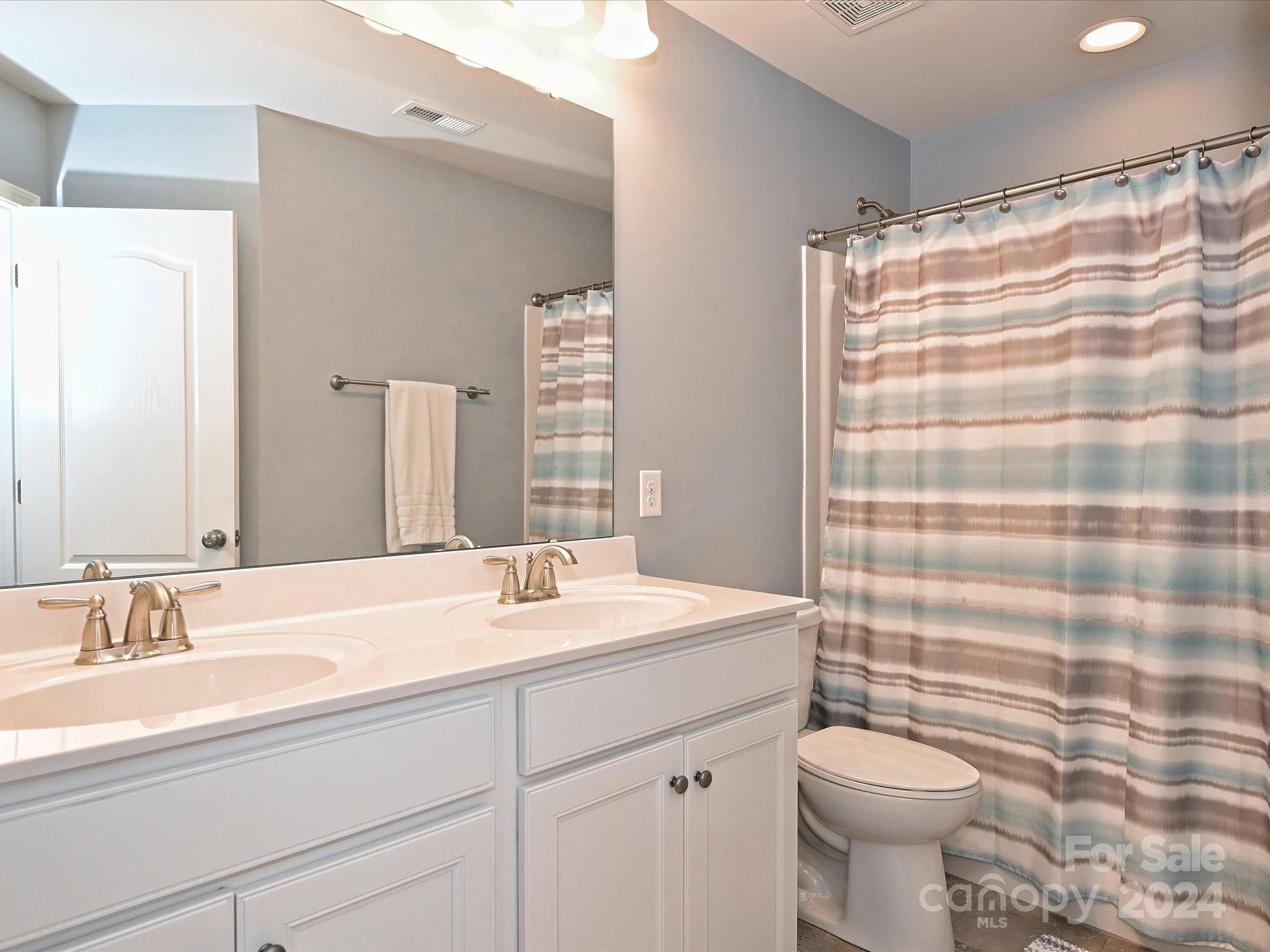 4041 Woodsmill Road Indian Land, SC 29707 - Photo 30 of 36 a bathroom with a sink toilet and shower