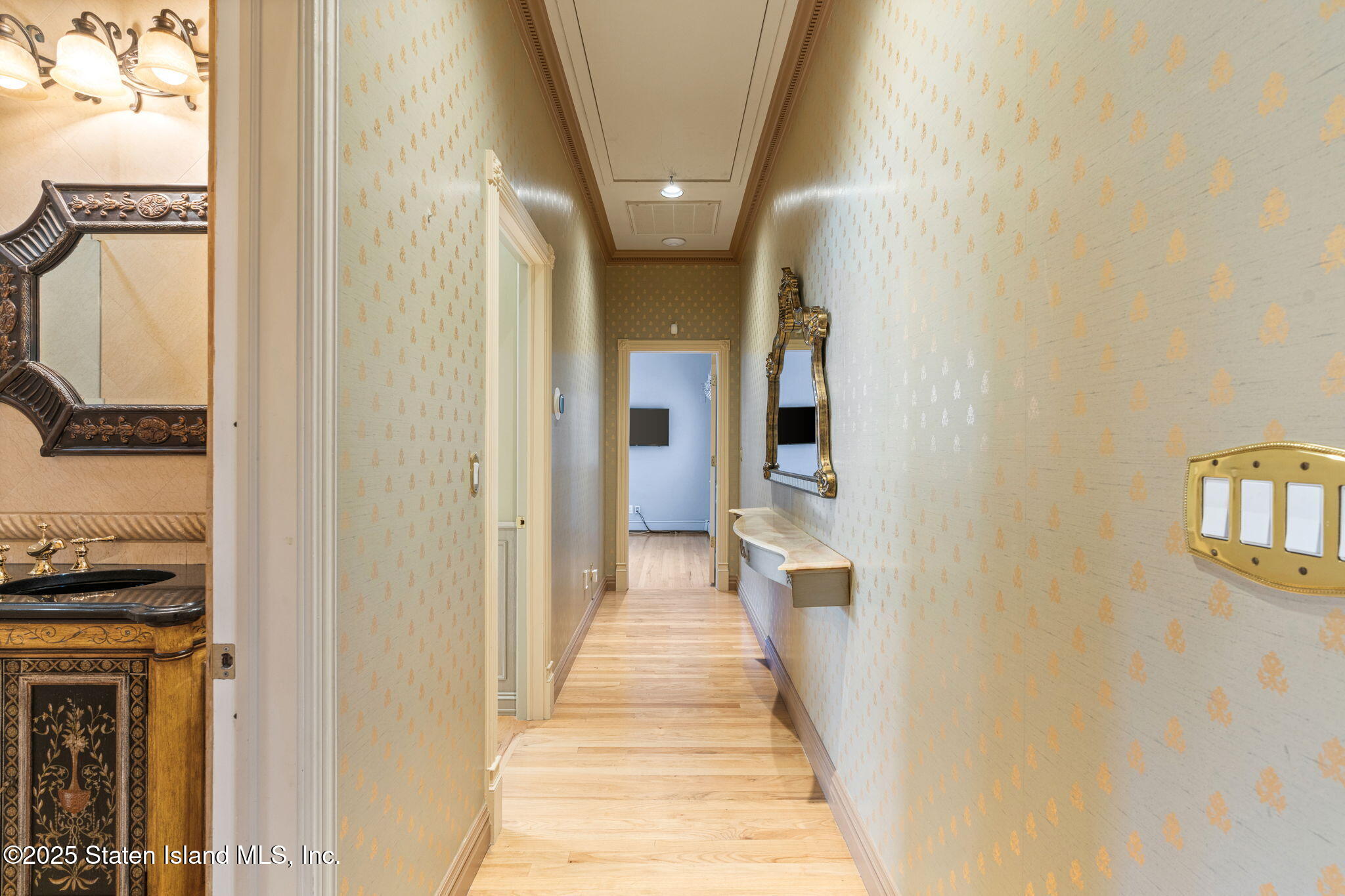 51 Romer Road Staten Island, NY 10304 - Photo 33 of 94 a view of a hallway with wooden floor and a living room