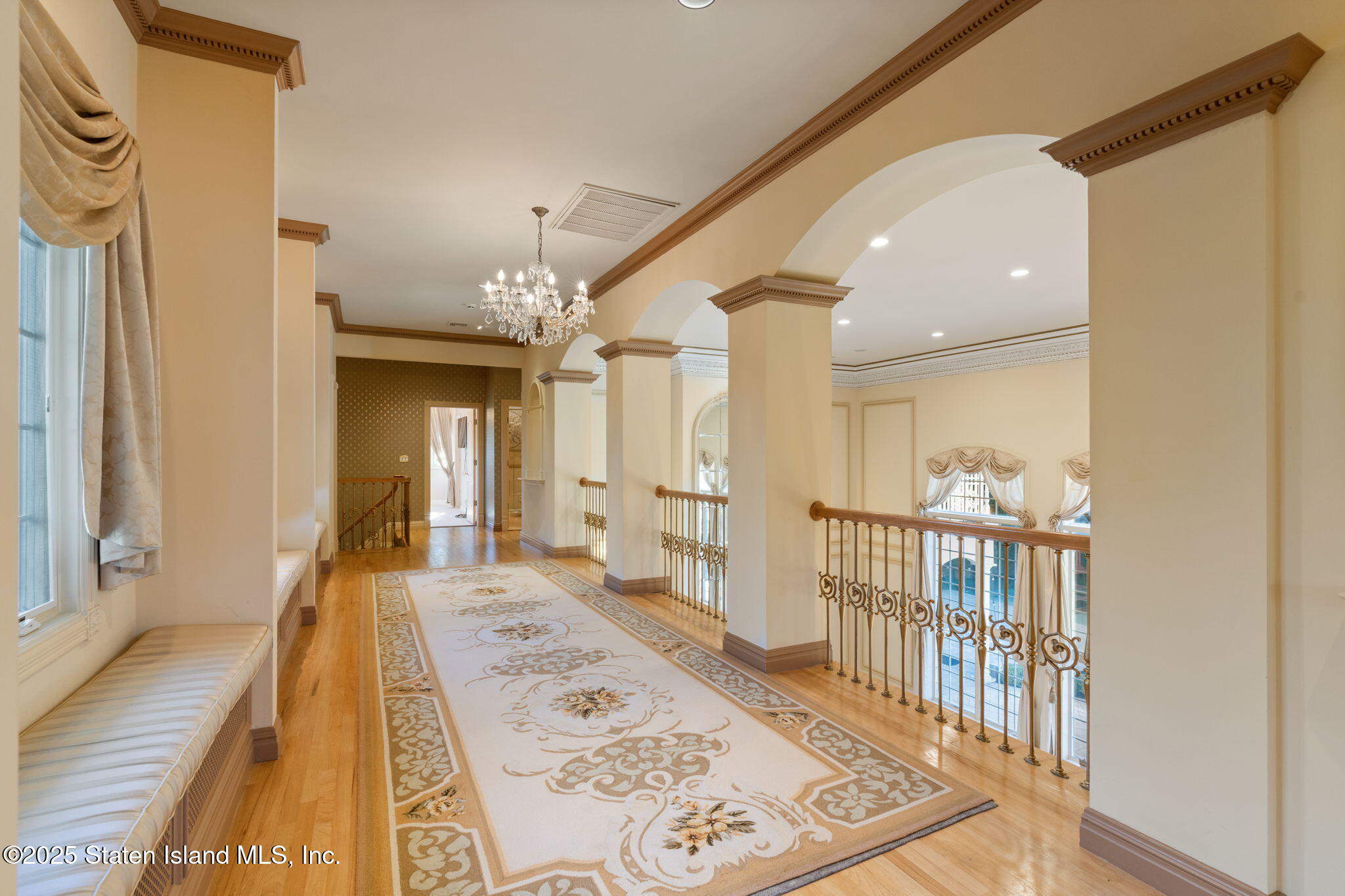 51 Romer Road Staten Island, NY 10304 - Photo 40 of 94 a view of a hallway to a livingroom with wooden floor and furniture