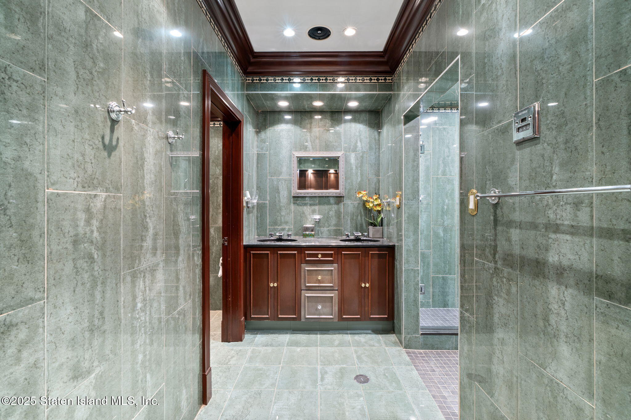 51 Romer Road Staten Island, NY 10304 - Photo 69 of 94 a bathroom with a mirror and a shower