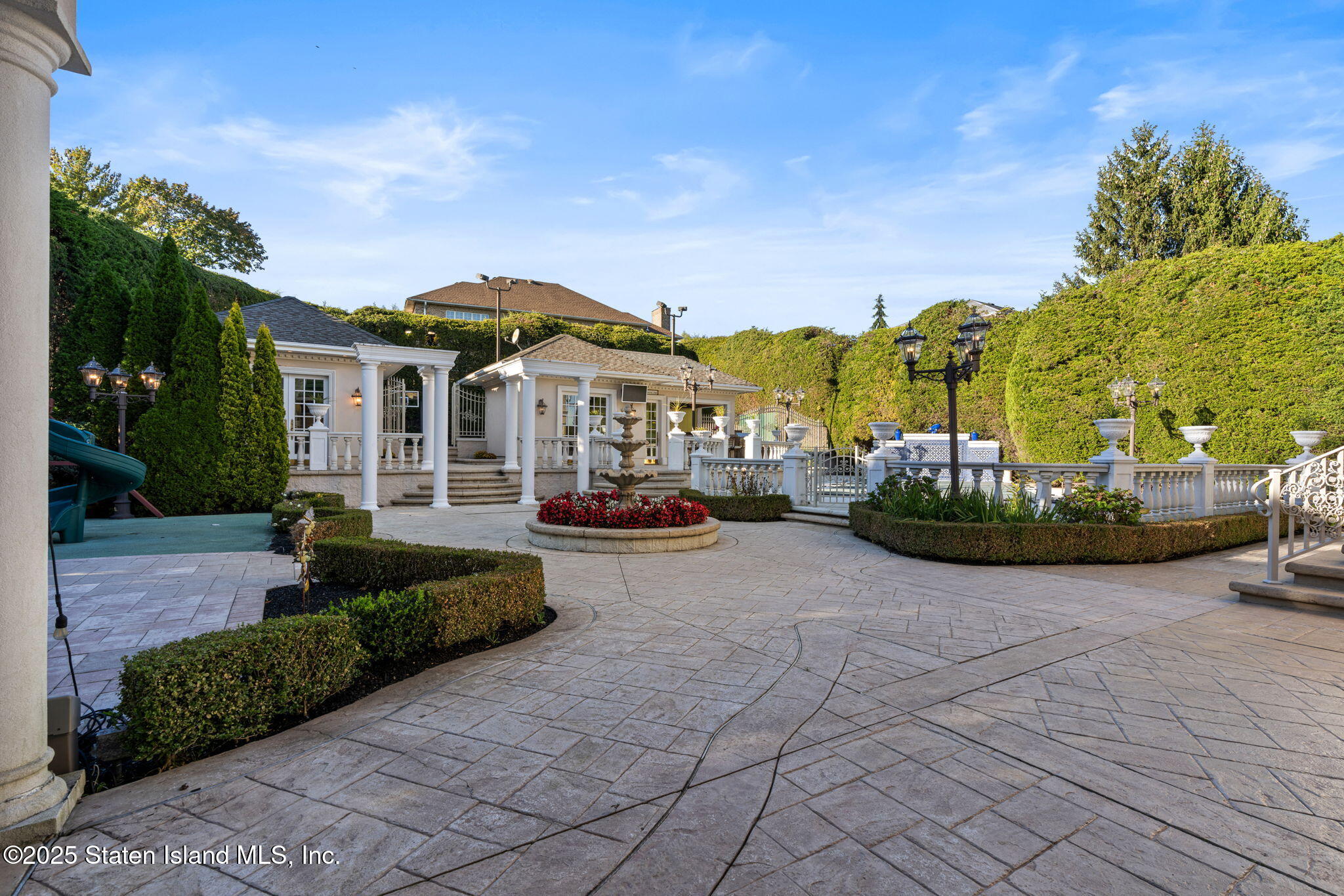 51 Romer Road Staten Island, NY 10304 - Photo 76 of 94 a view of a white house with a chairs in front of it