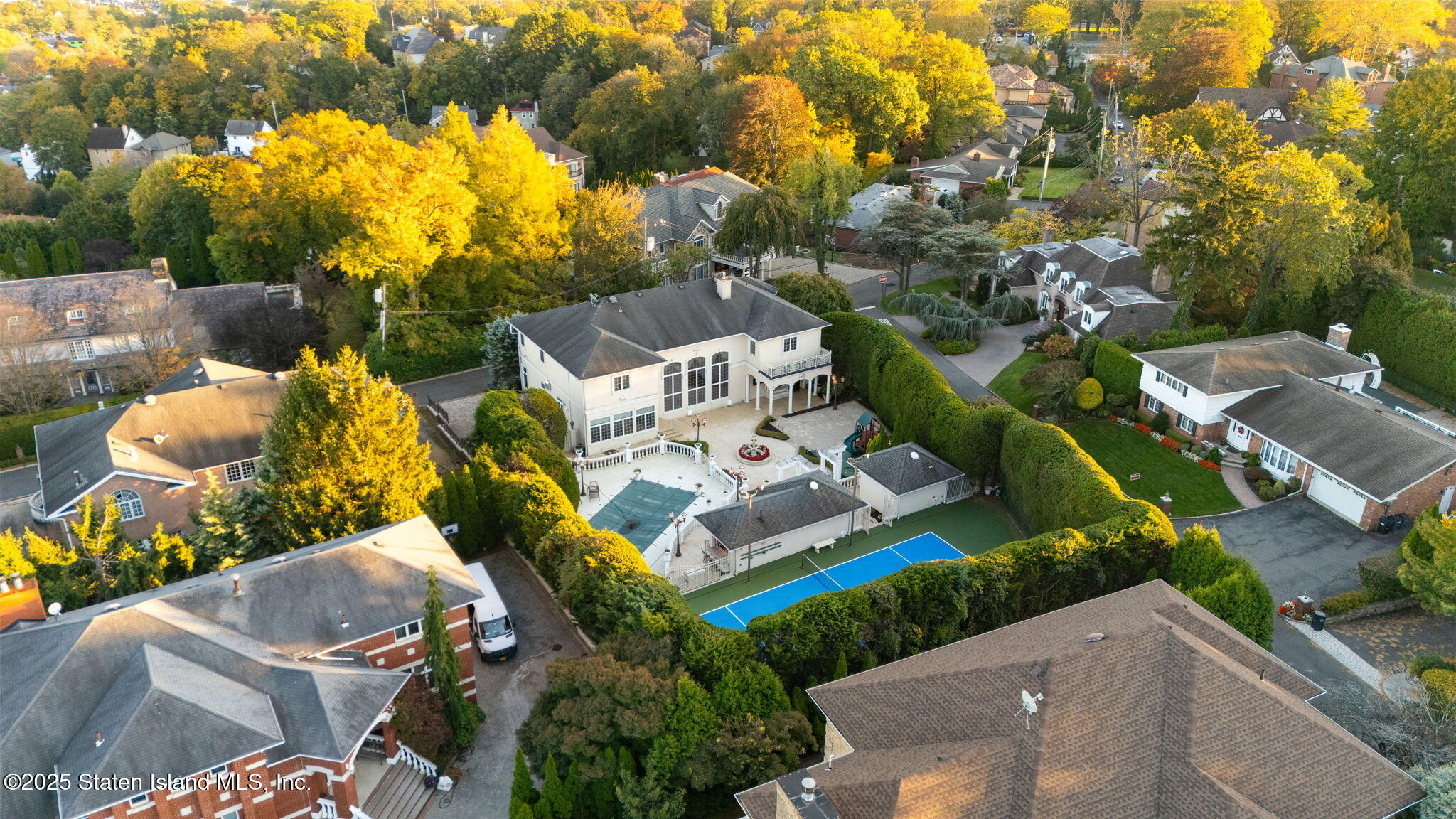 51 Romer Road Staten Island, NY 10304 - Photo 92 of 94 an aerial view of a house with swimming pool and large trees