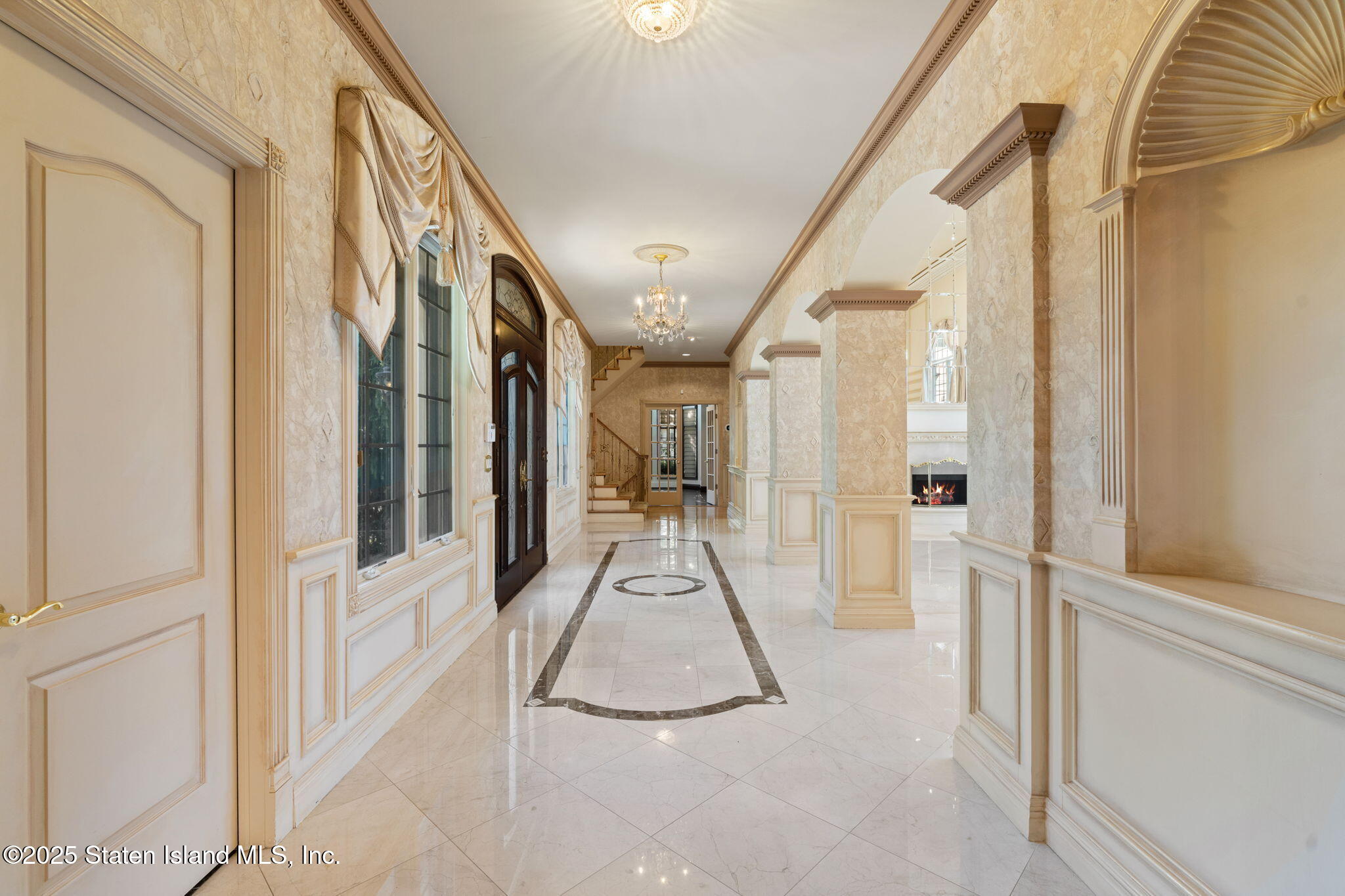 51 Romer Road Staten Island, NY 10304 - Photo 10 of 94 a view of a hallway with large mirror and furniture