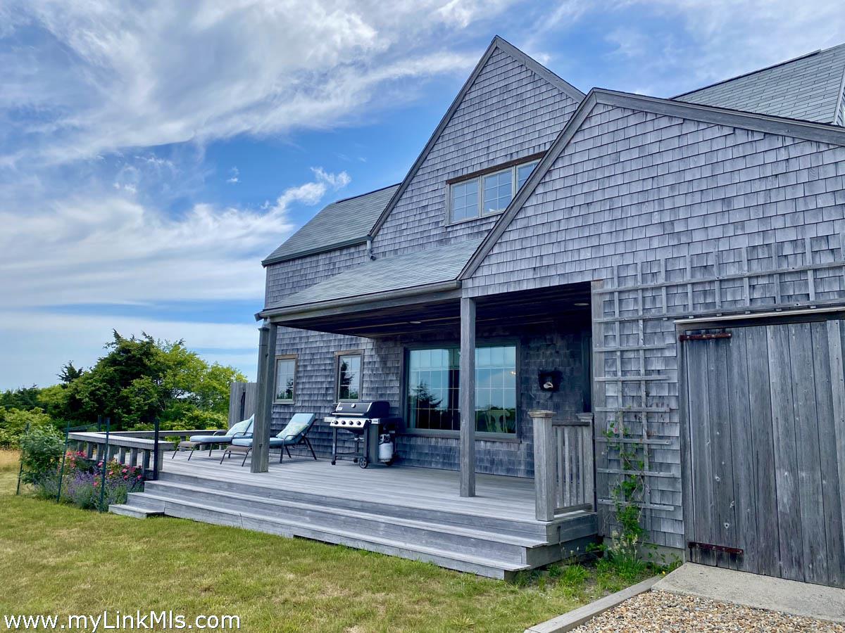 13 Eat Fire Spring Road Nantucket, MA 02554 - Photo 41 of 43 a view of a house with sitting area and garden