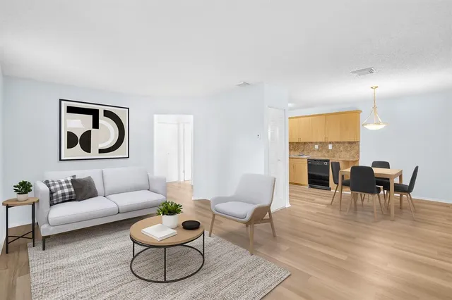 a living room with furniture and a table