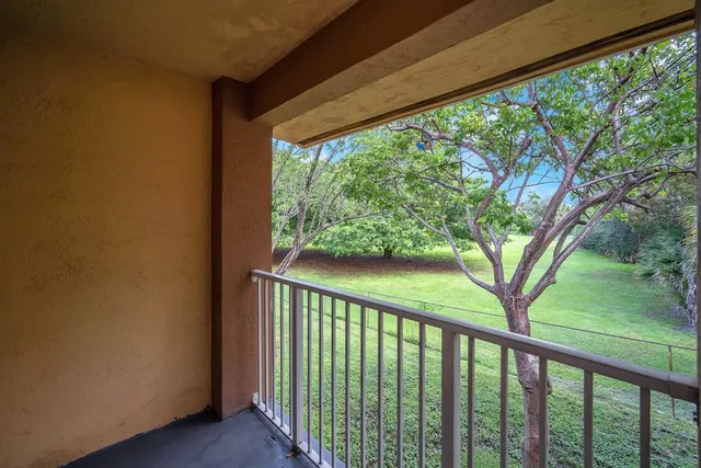 a view of balcony with yard