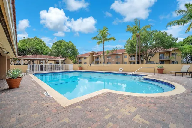 a view of a swimming pool with a patio