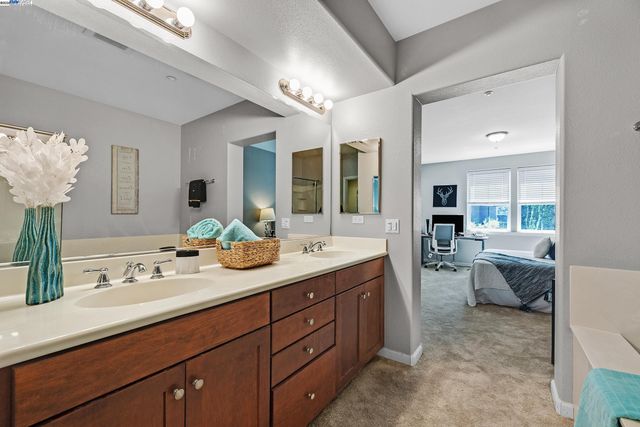 a white toilet sitting next to a white wall