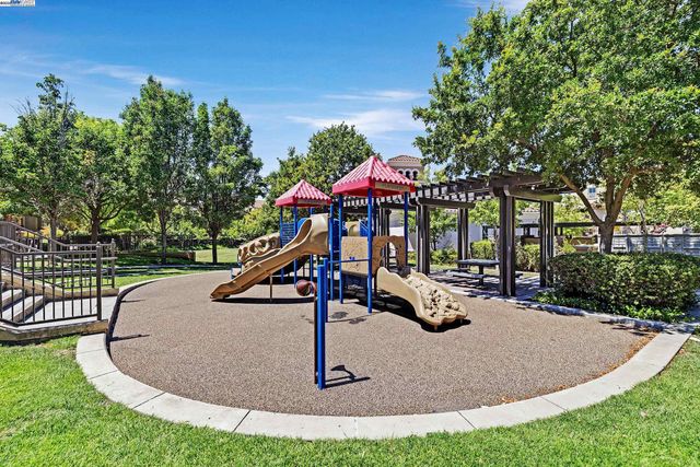 a view of a backyard with sitting area