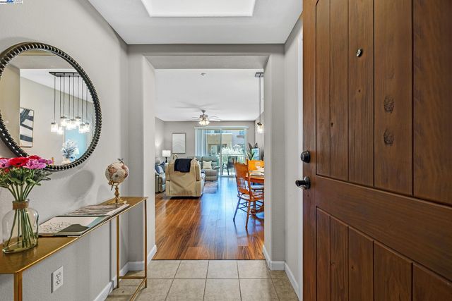 a view of a dining room with furniture wooden floor and a chandelier