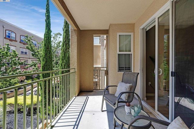 a view of a house with a yard and plants