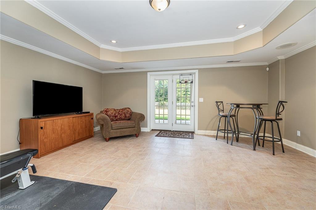 6657 Ridge Run Court Clemmons, NC 27012 - Photo 20 of 28 Finished Room in Basement with Tile Flooring and Easy Access to Covered Patio.