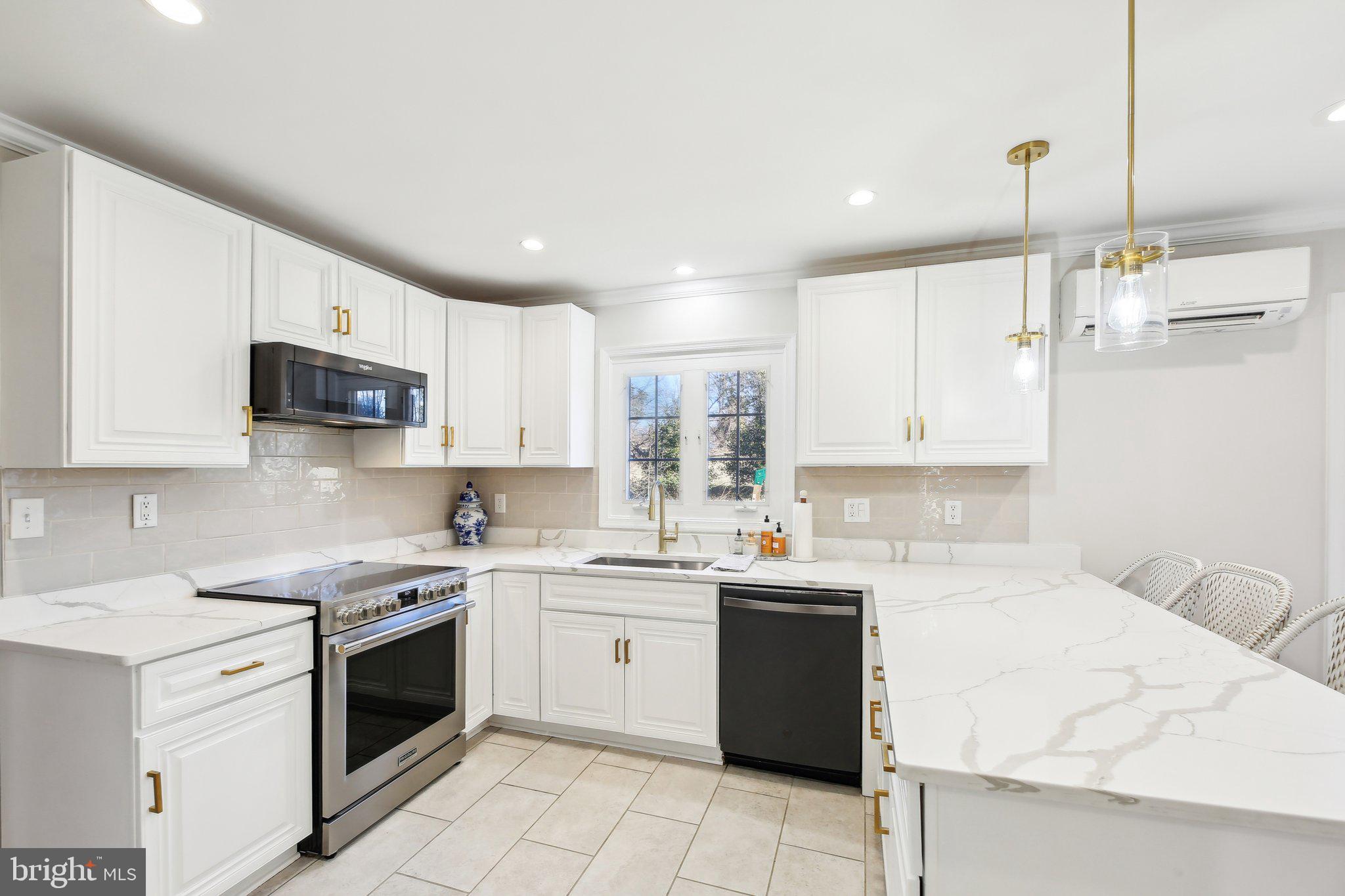 2139 Daisy Road Woodbine, MD 21797 - Photo 14 of 62 a kitchen with a sink stove top oven and cabinets