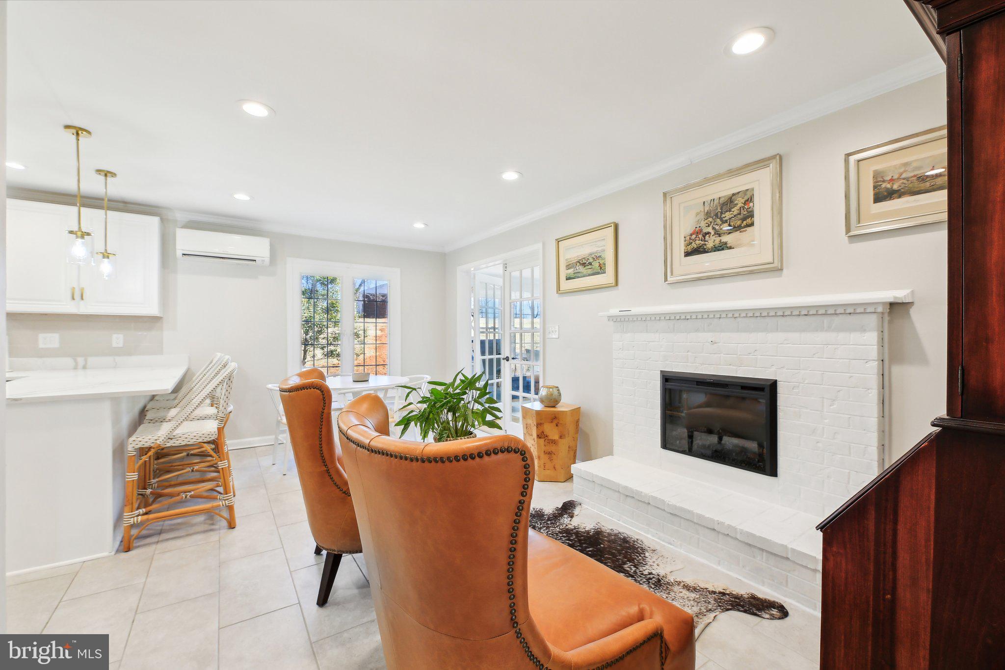 2139 Daisy Road Woodbine, MD 21797 - Photo 17 of 62 a living room with furniture a fireplace and a potted plant