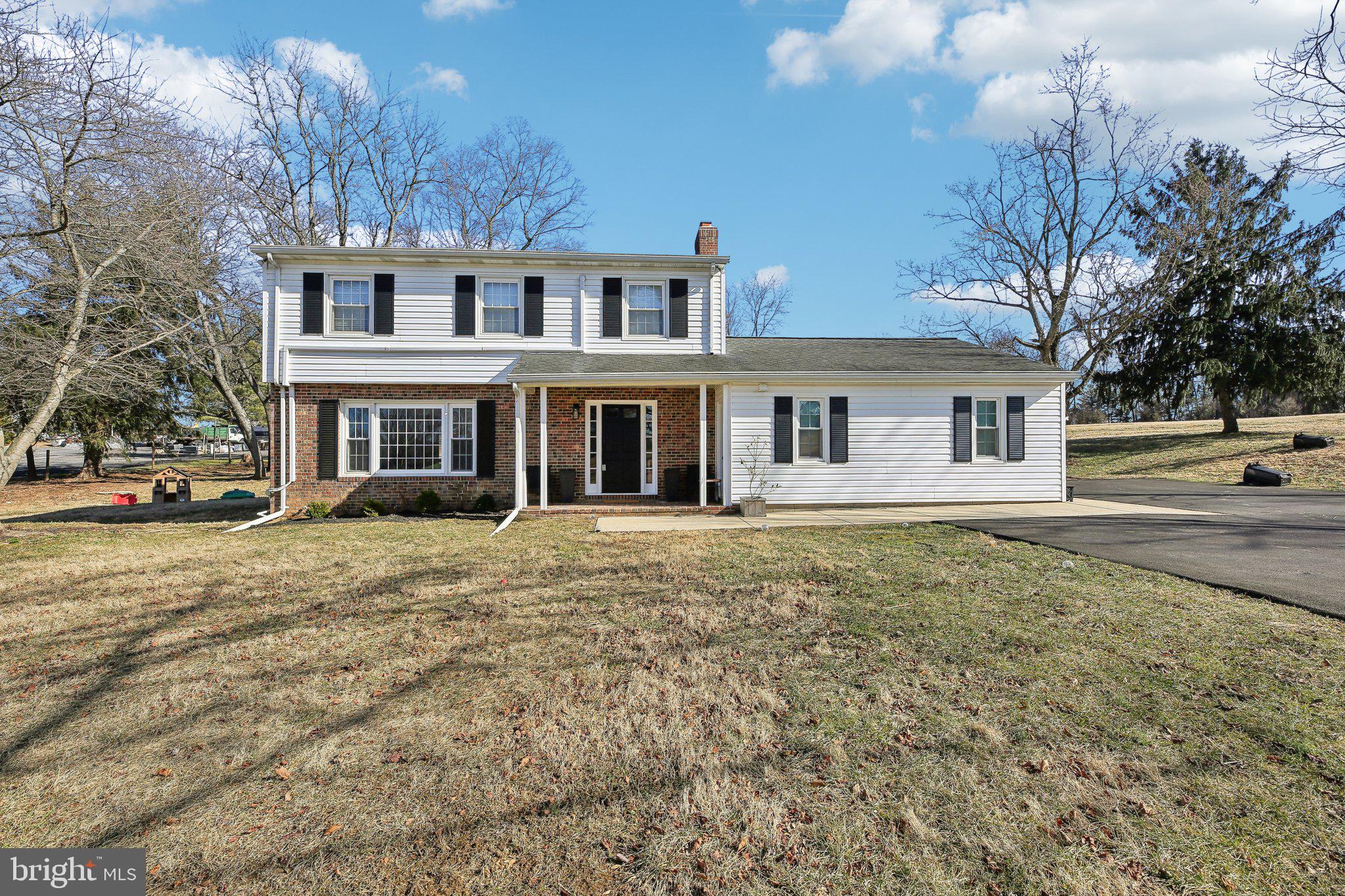 2139 Daisy Road Woodbine, MD 21797 - Photo 2 of 62 a front view of a house with a garden