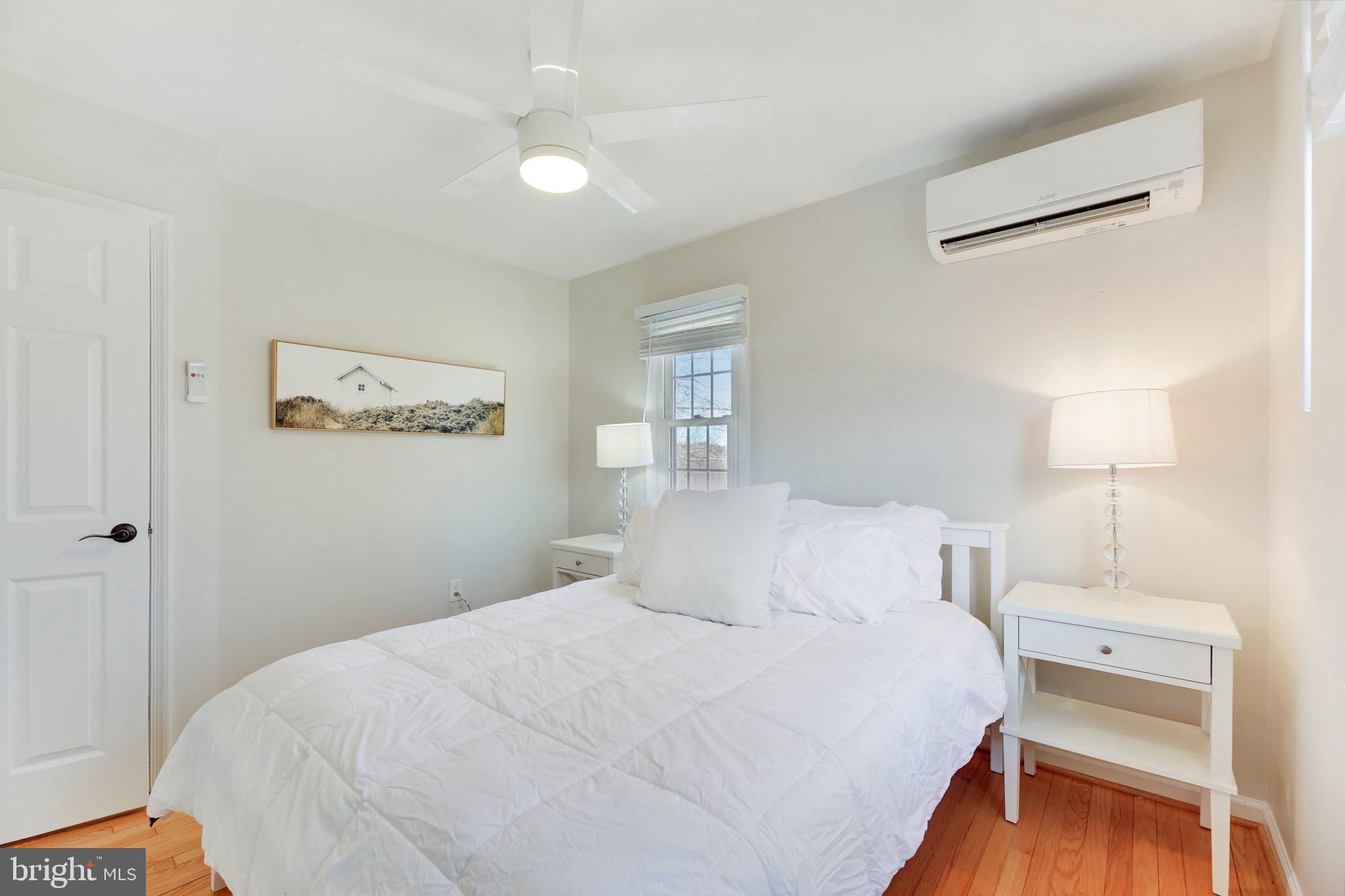 2139 Daisy Road Woodbine, MD 21797 - Photo 25 of 62 a bedroom with a bed and a lamp