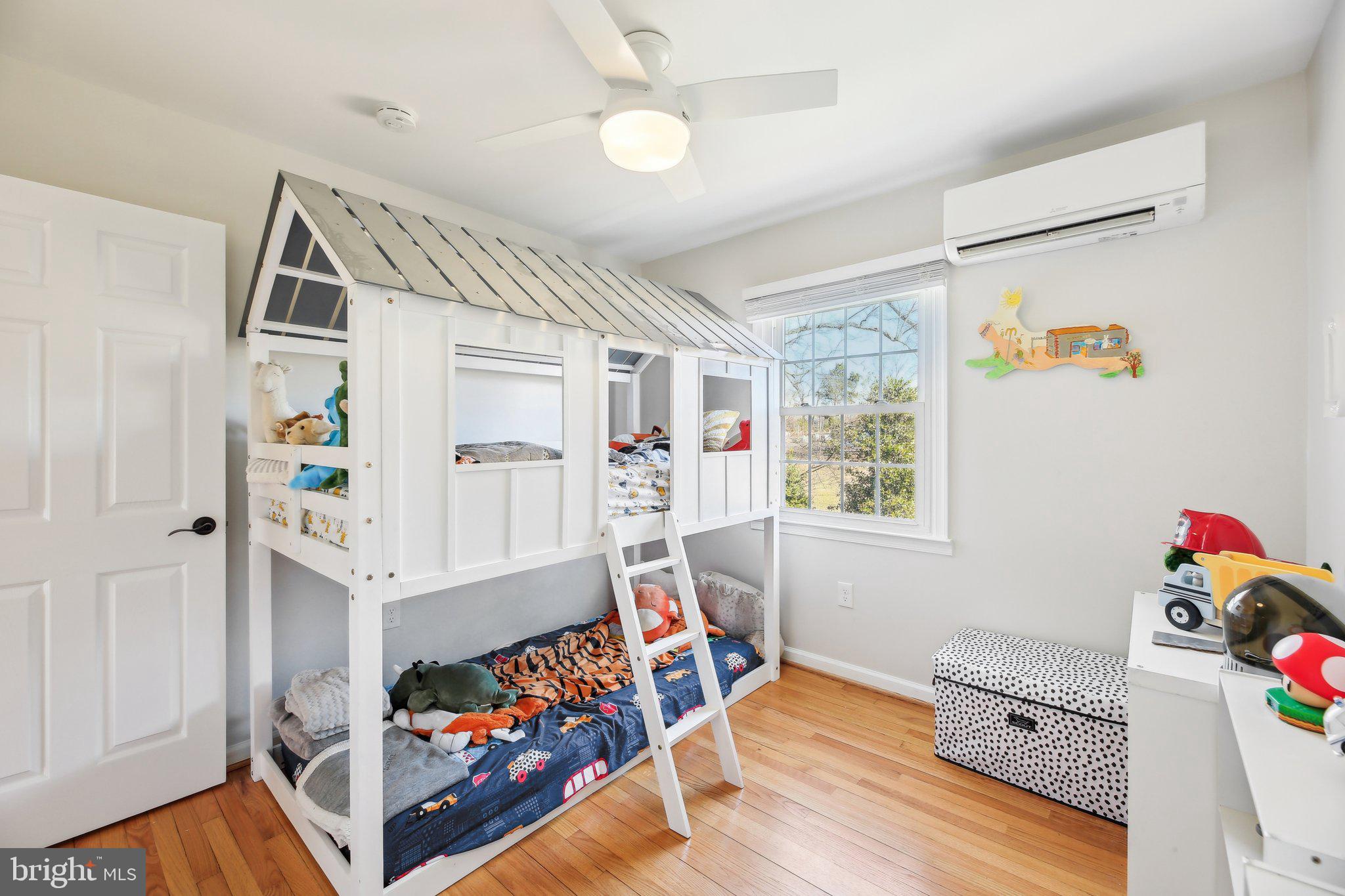2139 Daisy Road Woodbine, MD 21797 - Photo 26 of 62 a view of a bedroom with baby crib and a window