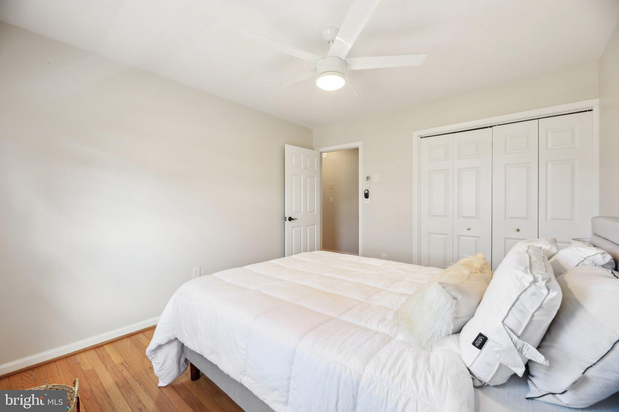 2139 Daisy Road Woodbine, MD 21797 - Photo 28 of 62 a bedroom with a bed and a white wall painting