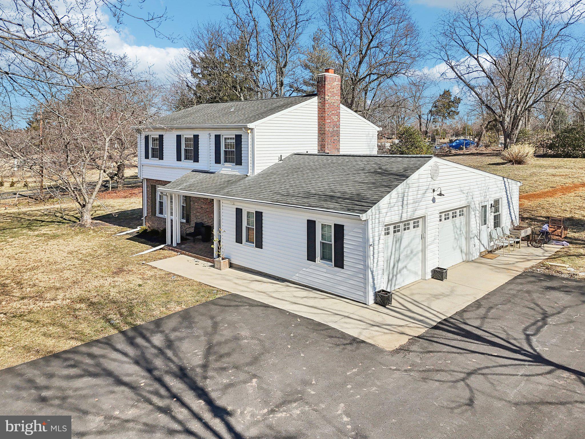 2139 Daisy Road Woodbine, MD 21797 - Photo 46 of 62 a white house that has a tree in front of it