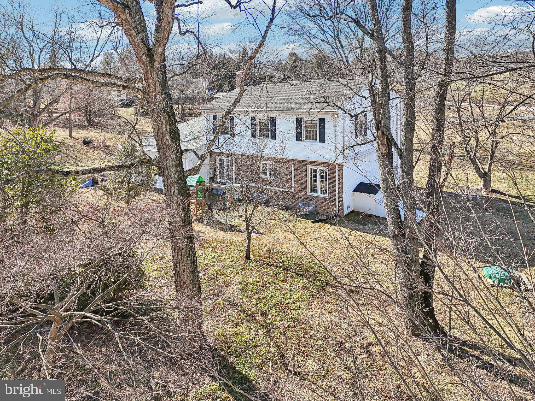 2139 Daisy Road Woodbine, MD 21797 - Photo 50 of 62 a view of a white house with a yard covered with snow