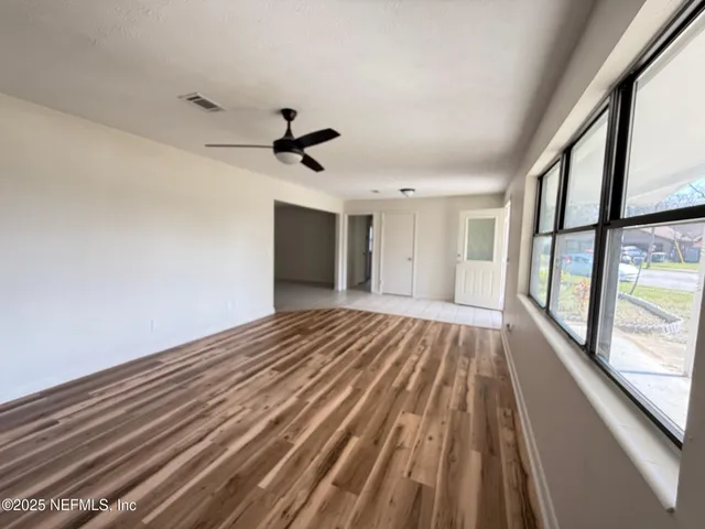 a view of an empty room with a window