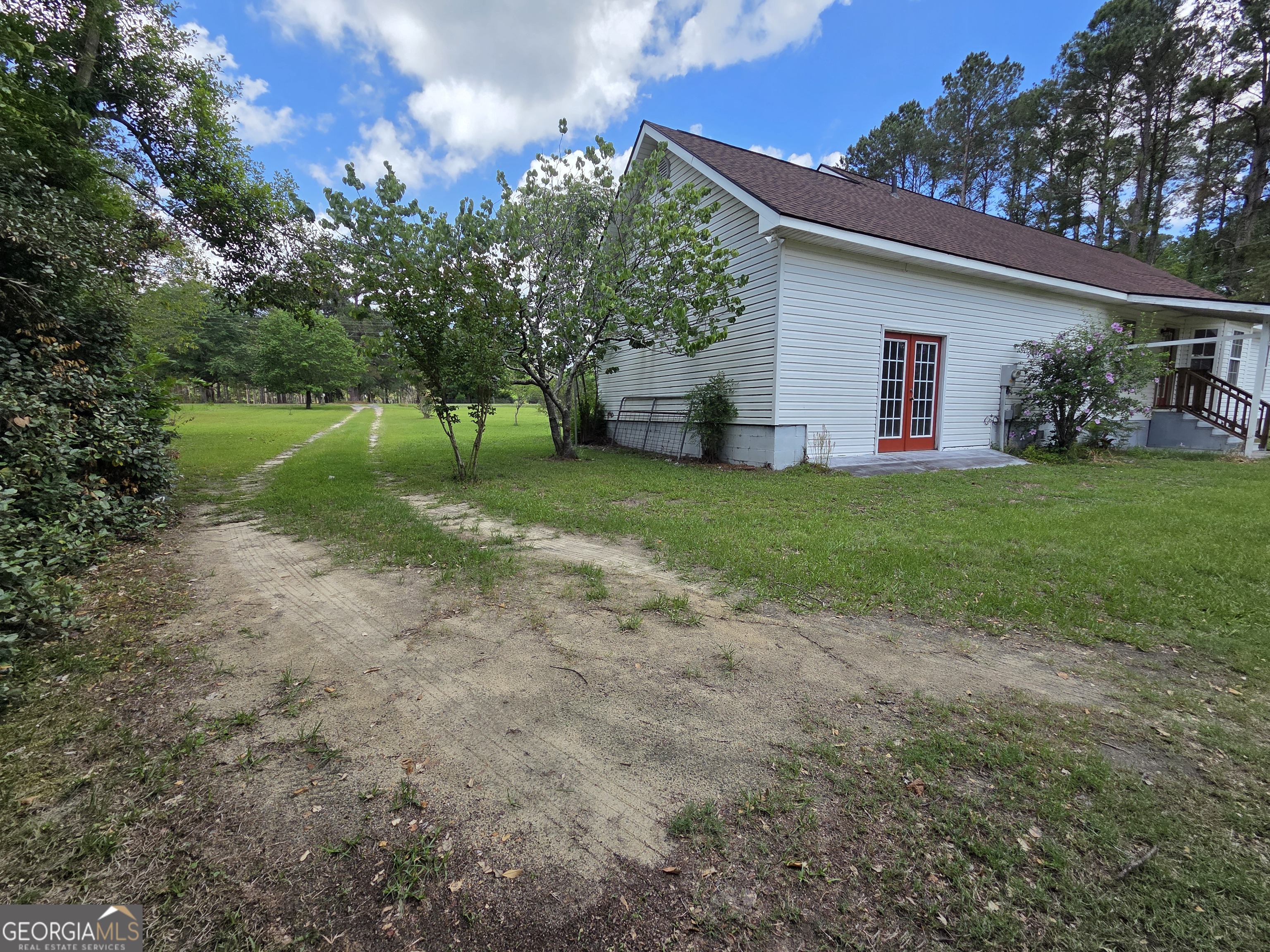 9546 Union Road Metter, GA 30439 - Photo 42 of 45 a view of a house with backyard and trees