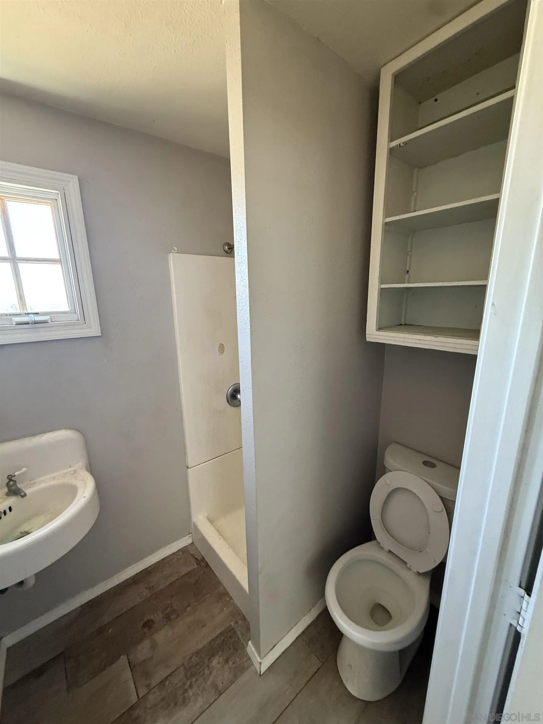 1431 Tierra Del Sol Road Boulevard, CA 91905 - Photo 7 of 9 a bathroom with a toilet and a sink