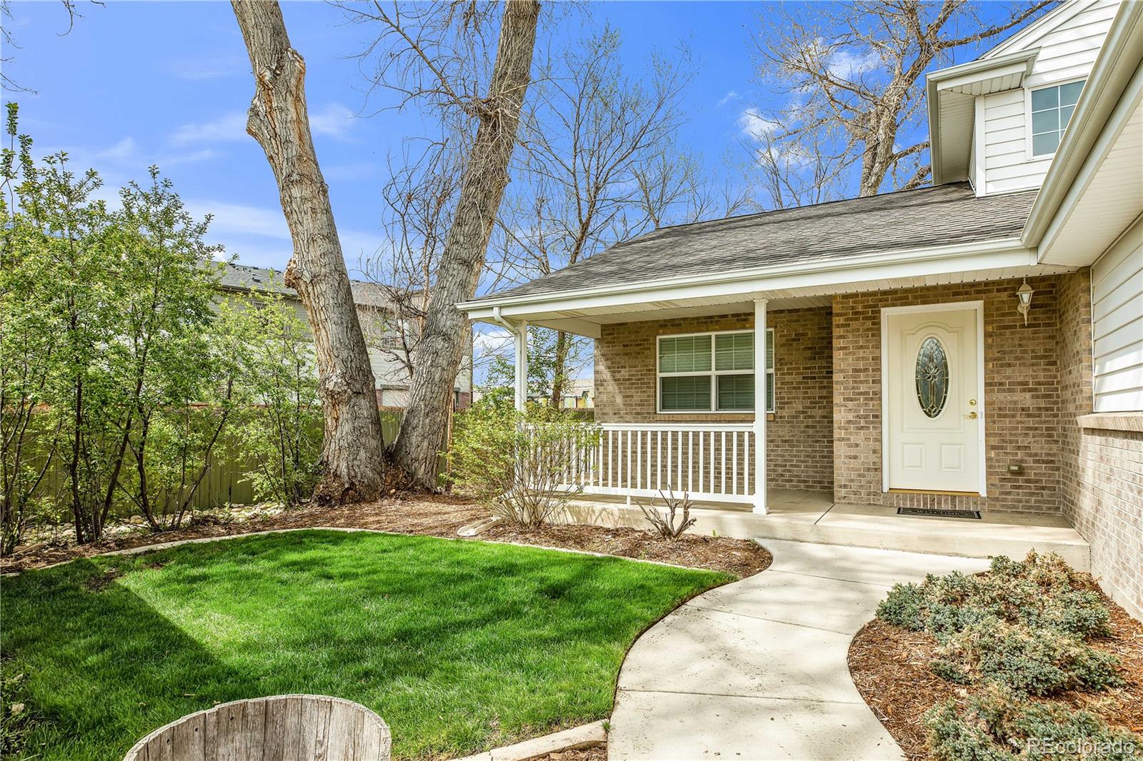 4505 Simms Court Wheat Ridge, CO 80033 - Photo 6 of 37 front view of a house with a yard