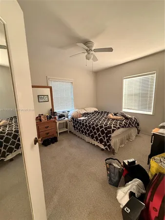 a bedroom with furniture and a window