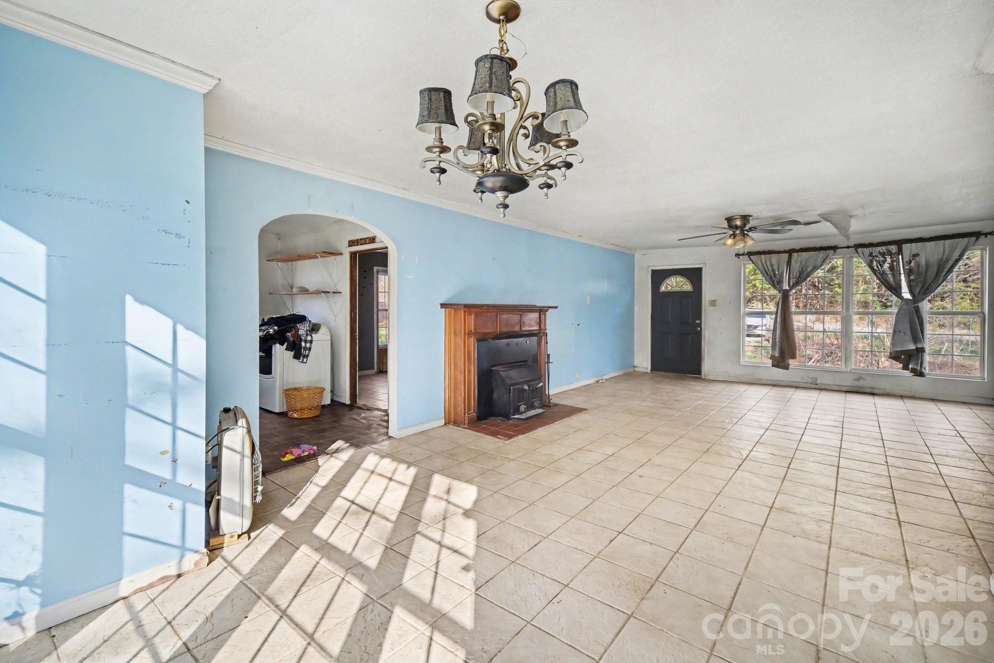453 Robert Road Cherryville, NC 28021 - Photo 12 of 36 a view of a hallway with a chandelier