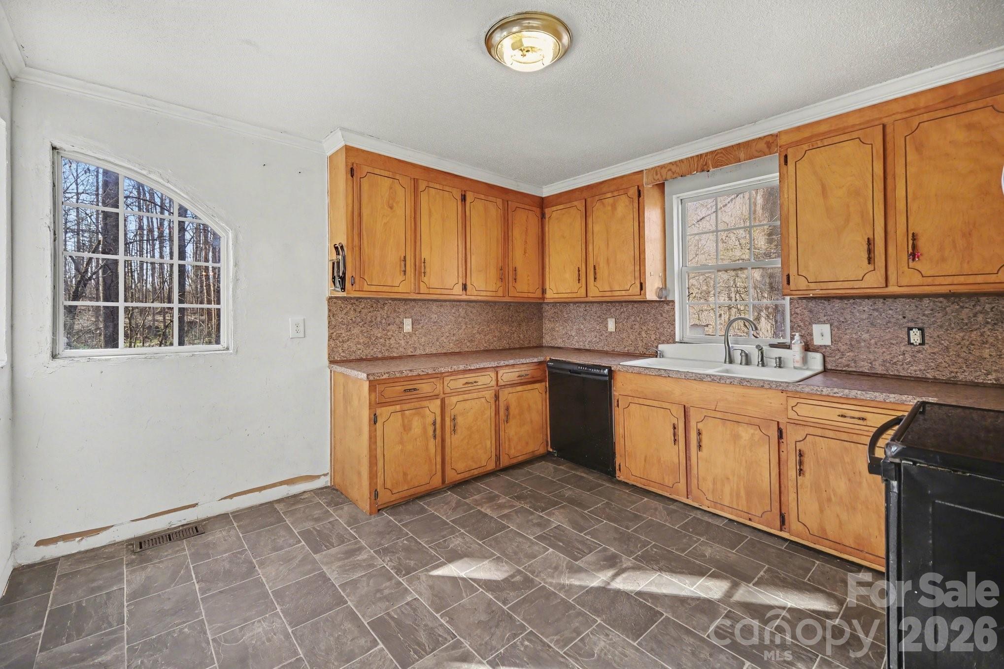 453 Robert Road Cherryville, NC 28021 - Photo 15 of 36 a kitchen with a sink stove and cabinets